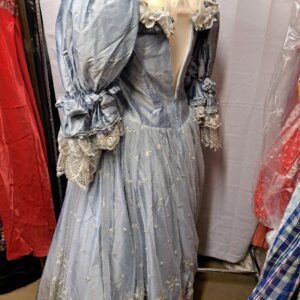 Women's pale blue silk lace dress shown on a dressmaker's dummy. Lace detail on the neckline and gathered cuffs